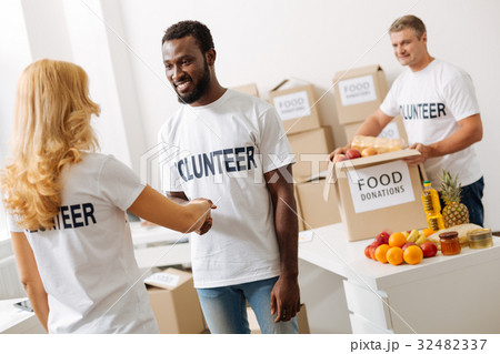 Diligent devoted man meeting new volunteer 32482337