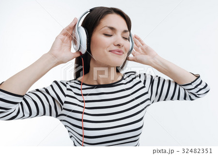 Positive delighted brunette putting hands on 32482351