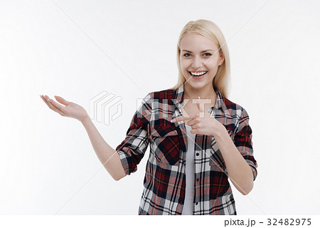 Attractive female pointing at her right hand Attractive female pointing at her right hand 32482975