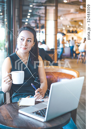 Business woman working on a laptop in the office. 32488309