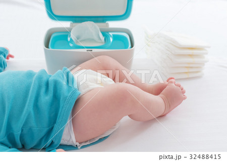 Baby boy preparing for a diaper change 32488415