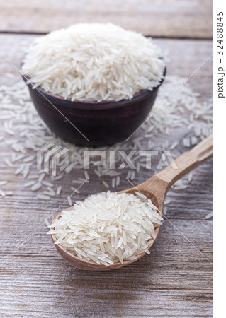 rice on a wooden background 32488845