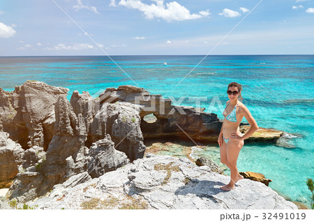 women in sunglasses and bikini 32491019