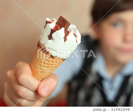 ice cream cone with chocolate piece  32492049