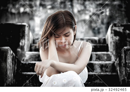 woman in frustrated depressed sitting on stairs woman in frustrated depressed sitting on stairs 32492465