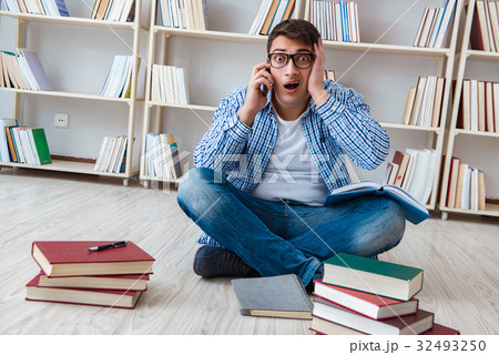Young student studying with books 32493250
