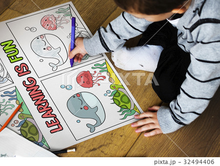 Young boy working on drawing pad network graphic overlay 32494406