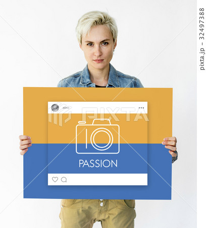 People holding placard with camera icon 32497388