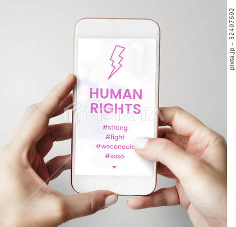 Hands working on digital device network graphic overlay Hands working on digital device network graphic overlay 32497692