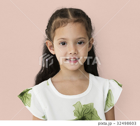 Young little girl with awkward smile expression portrait 32498603