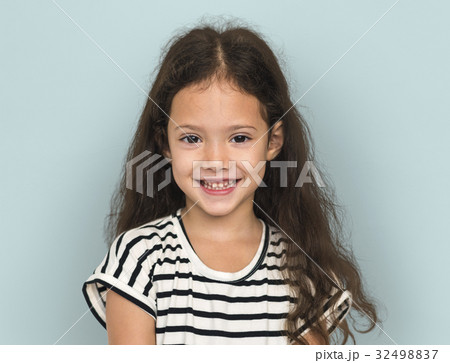 Little girl smiling casual studio portrait 32498837