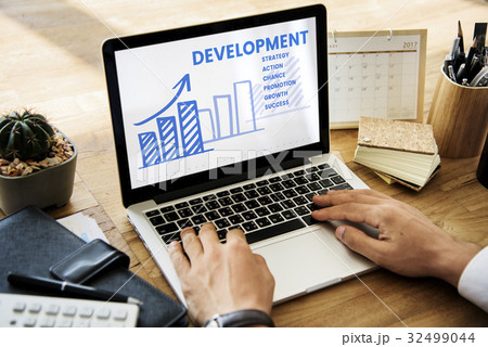 Hands working on laptop network graphic overlay Hands working on laptop network graphic overlay 32499044