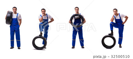 Handsome tyre repairman isolated on white 32500510
