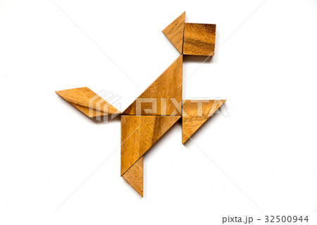Wooden tangram puzzle in happy dog shape Wooden tangram puzzle in happy dog shape 32500944
