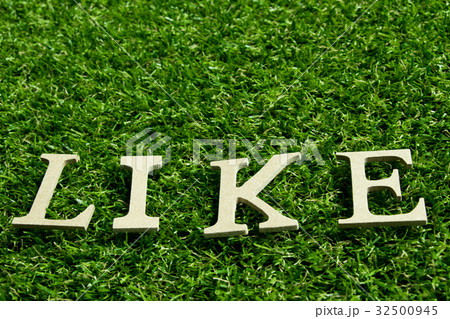 Like wording placed on artificial green grass 32500945