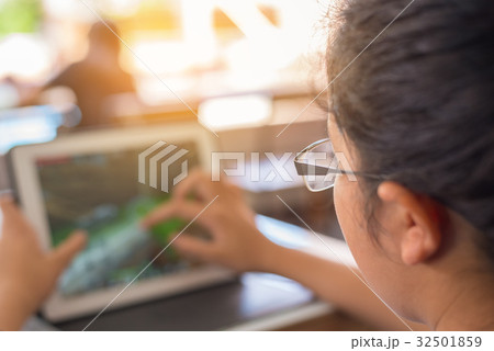 girl touching on screen of tablet. girl touching on screen of tablet. 32501859