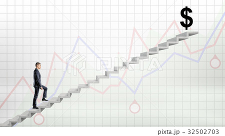 A businessman walking up on concrete stairway on A businessman walking up on concrete stairway on 32502703