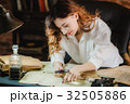 funny woman looking through a magnifying glass to 32505886
