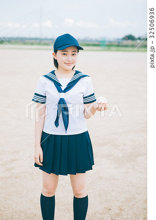 野球ボールとマネージャーの女子高生の写真素材