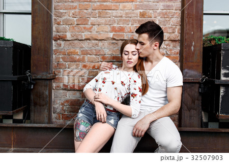 Portrait of young modern couple in love, posing Portrait of young modern couple in love, posing 32507903