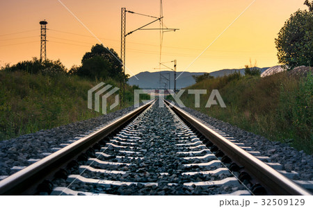 Vintage empty railroad at sunset time Vintage empty railroad at sunset time 32509129