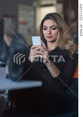 Typing business message. Confident young woman in 32511364