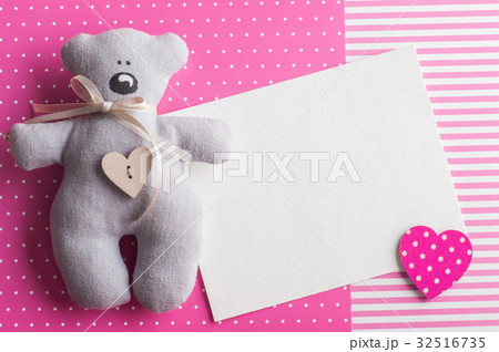 Blank card on pink background with teddy bear 32516735