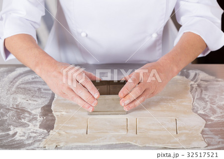 Baker kneading dough 32517521