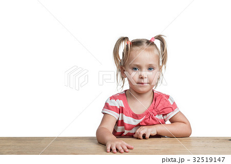 Sweet preschool girl at a desk 32519147