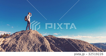 Man walking on the edge of a cliff 32519226