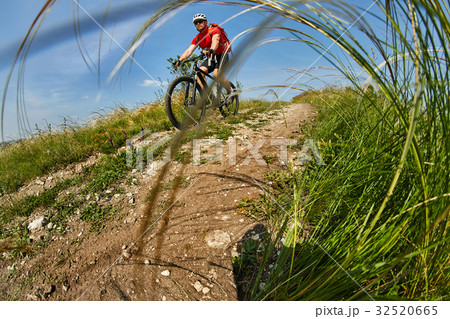 Young cyclist riding the mountain bike on the 32520665