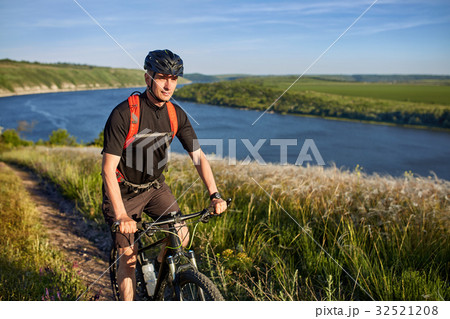 Traveler has adventur on meadow on riverside 32521208