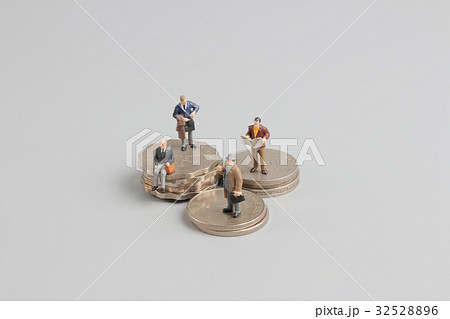 Business man on the top of coins stack 32528896