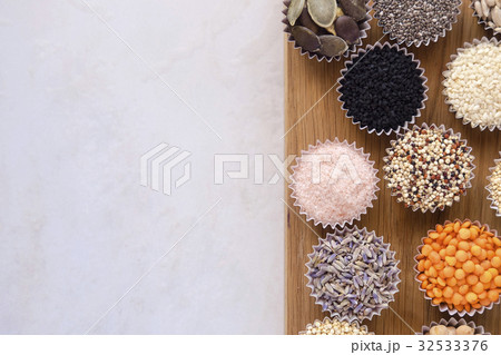 Various superfoods on white table 32533376