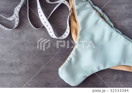 Woman swimming bikini and measuring tape 32533384
