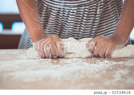 girl hand kneading dough prepare for baking cookie 32538618
