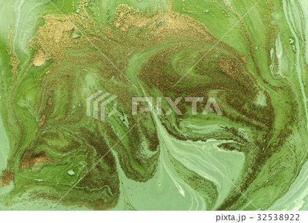 Marbled green and gold abstract background. Liquid Marbled green and gold abstract background. Liquid 32538922