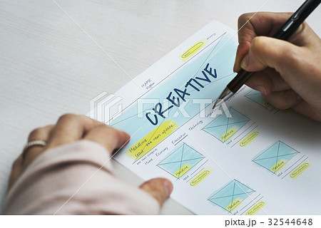 Hands working on paper network graphic overlay 32544648