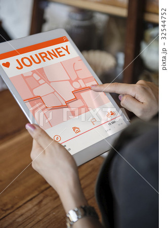 Hands working on digital device network graphic overlay 32544752