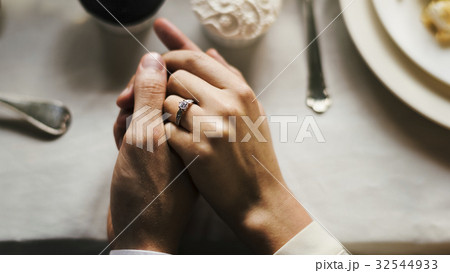 Bride and Groom Holding Hands on Wedding Reception Bride and Groom Holding Hands on Wedding Reception 32544933
