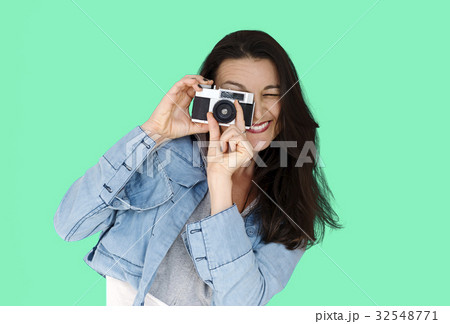 A woman using camera to capture 32548771