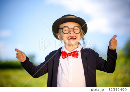 Funny little girl in bow tie and bowler hat Funny little girl in bow tie and bowler hat 32552490