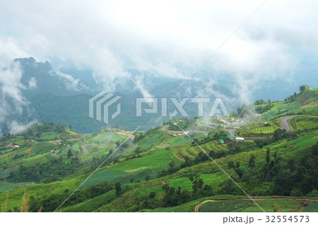 Morning mountain landscape with waves of fog Morning mountain landscape with waves of fog 32554573