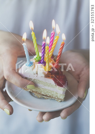 Girl holding beautiful appetizing birthday cake  32555763
