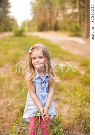Happy girl in a summer park 32556239