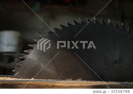 Circular saw cutting wooden plank. Circular saw cutting wooden plank. 32556799