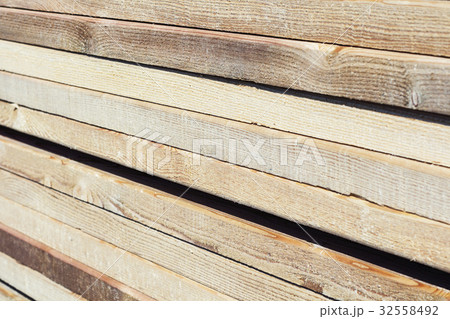 wooden planks on a construction site. 32558492