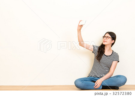 model selfie with modern cell phone smiling model selfie with modern cell phone smiling 32572380