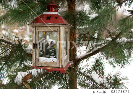 Christmas lantern on a Christmas tree 32573372