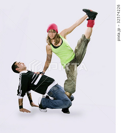 Teenagers dancing breakdance in action Teenagers dancing breakdance in action 32574226